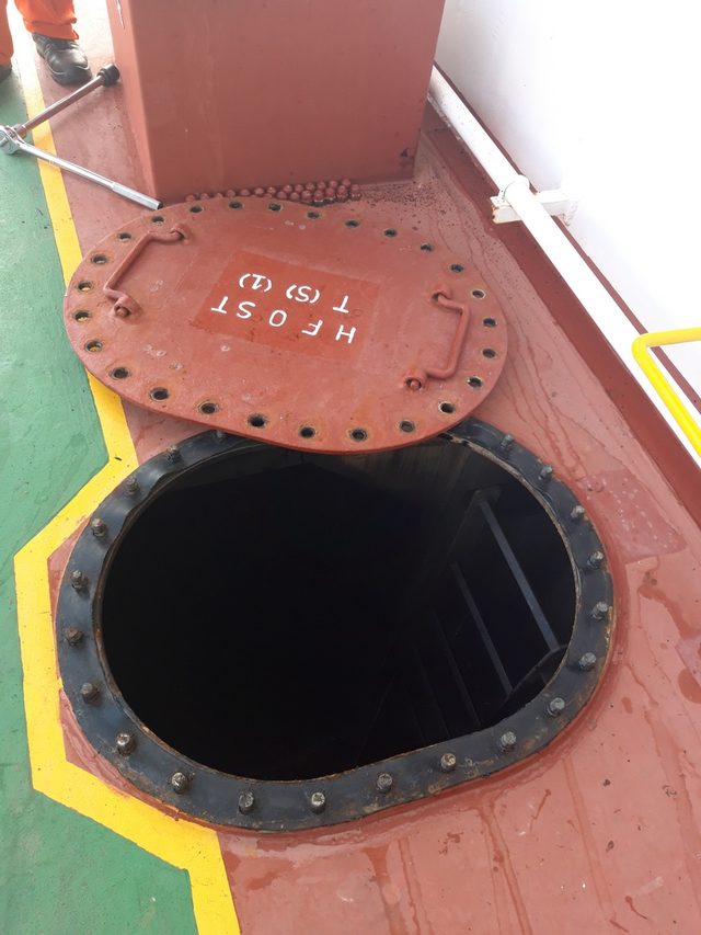 Open manhole of a fuel oil tank on the tank top